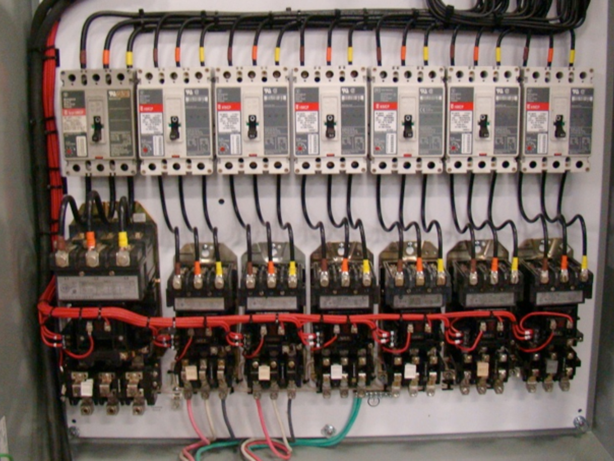 Open electrical switchboard containing circuit breakers, contactors and control wiring