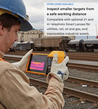 Technician using a Fluke TiX501 thermal camera to inspect railway assets from a distance