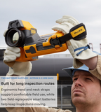 Technician holding a Fluke TiX501 overhead during an outdoor industrial inspection