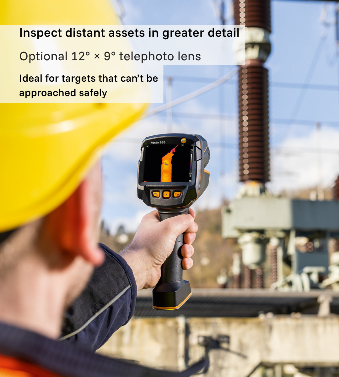 Engineer using a Testo 883 thermal camera to inspect distant substation equipment