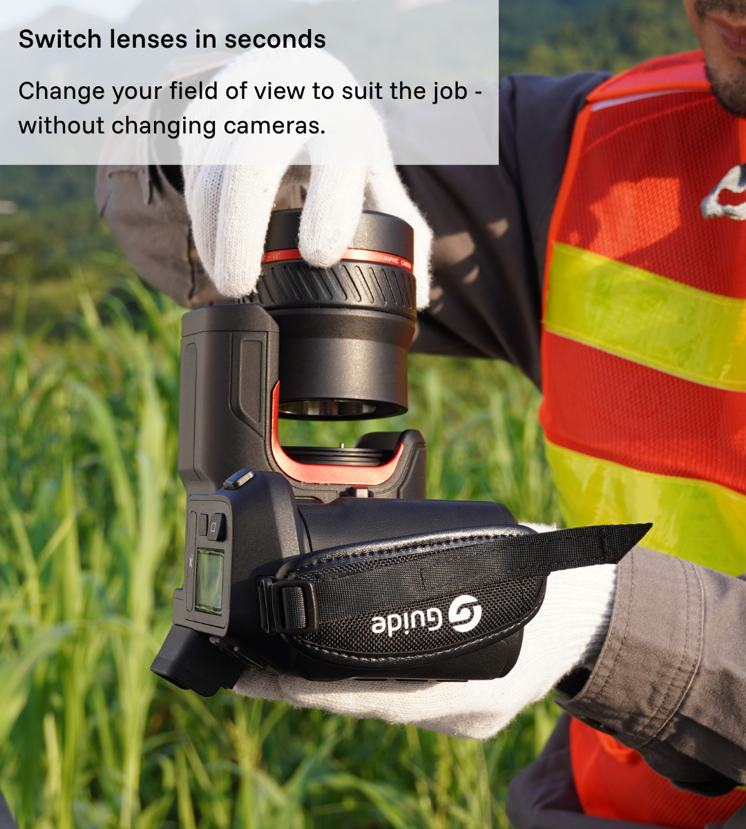 Guide PT II thermal camera being used in the field with a user quickly switching between interchangeable lenses.
